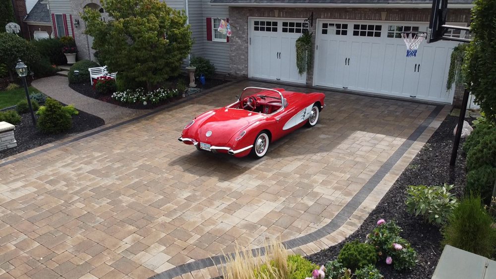 red car parked in the driveway red car parked in the driveway