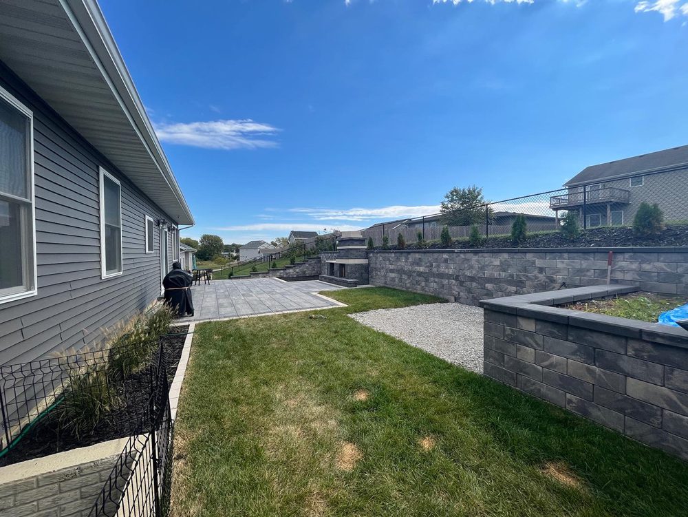 A professional landscaping job with patio and retaining walls A professional landscaping job with patio and retaining walls