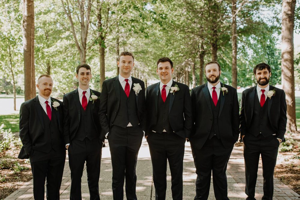 groom and bridegroom wearing a black suit