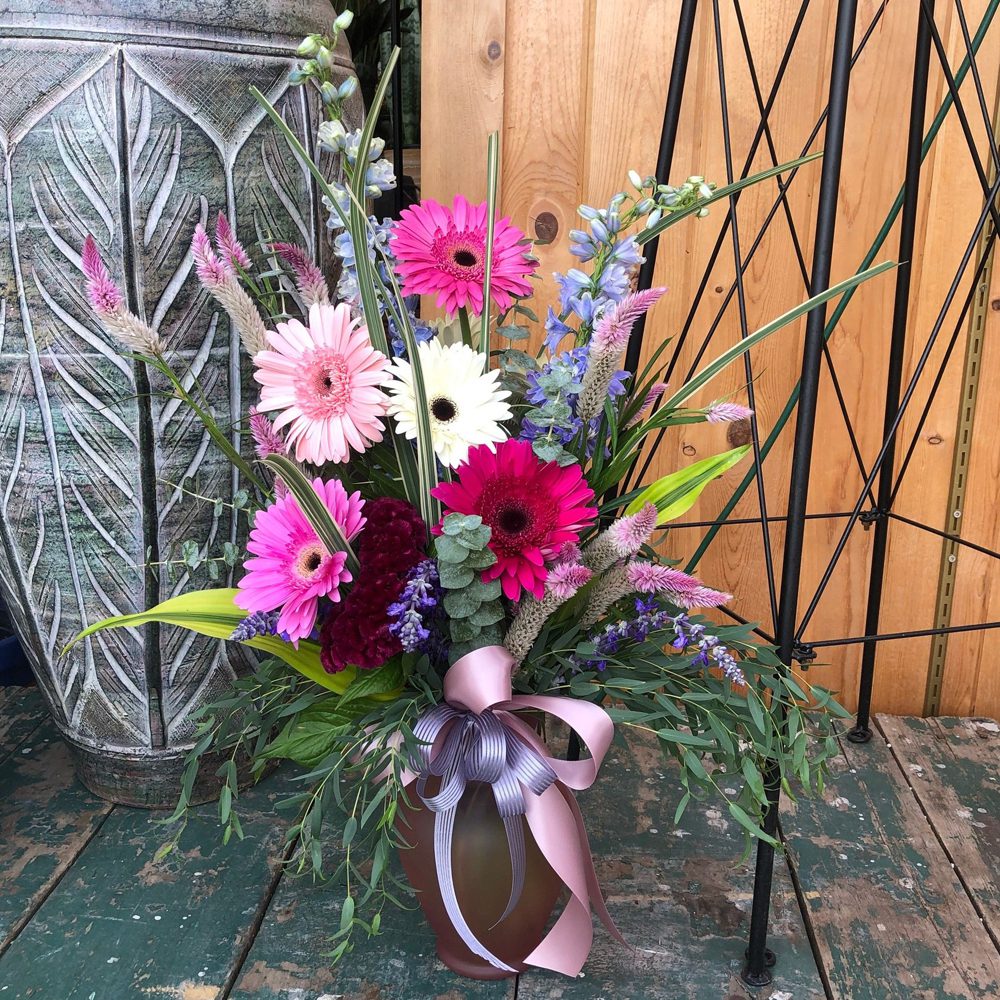 white, pink, magenta, red, maroon flowers bundled together
