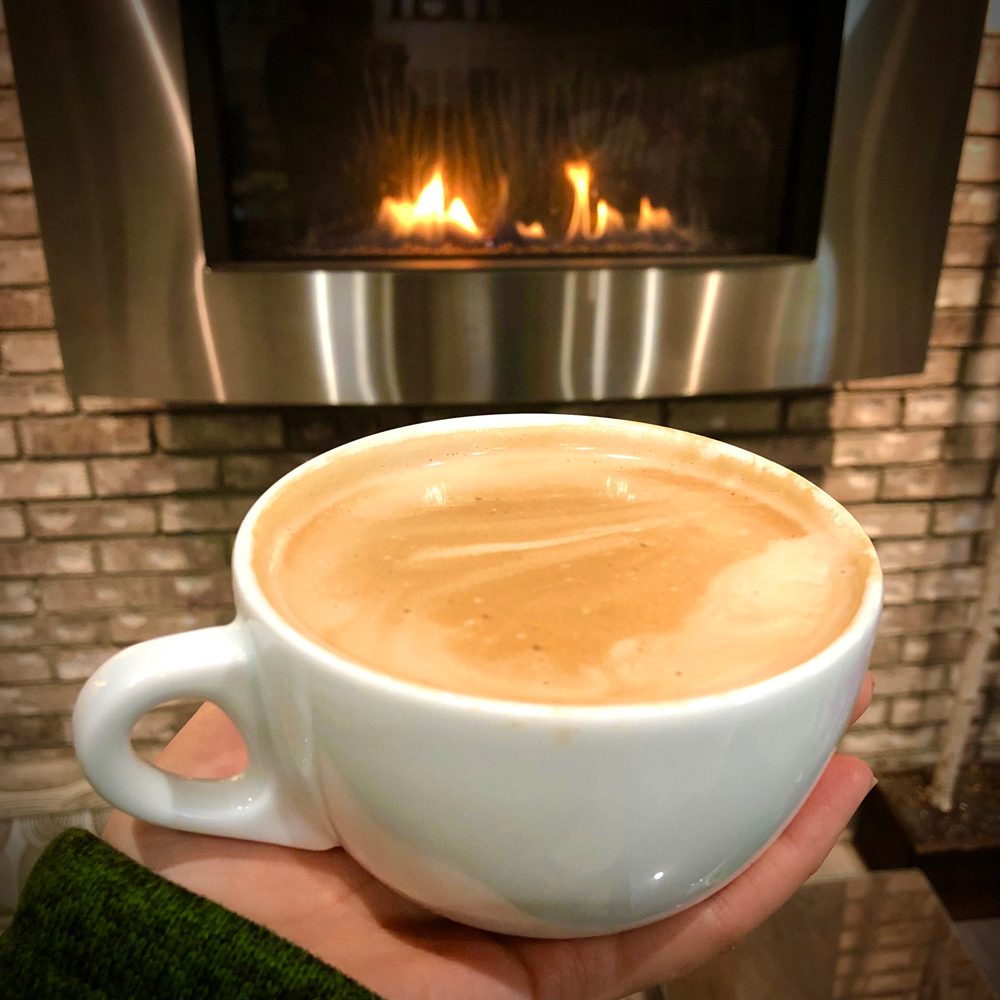 holding a cup of coffee holding a cup of coffee