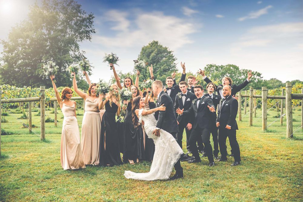 newlywed couple with their bridesmaid and bridegroom