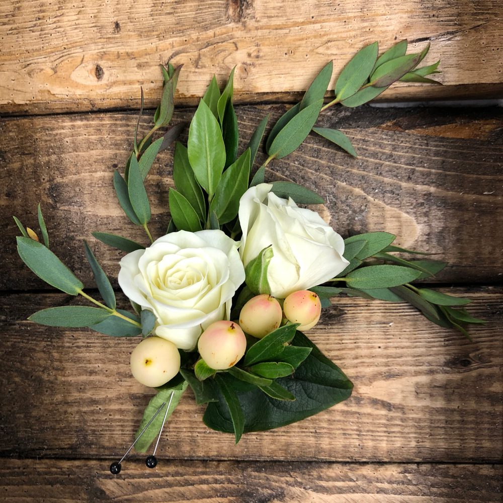 beautiful boutonniere of white roses