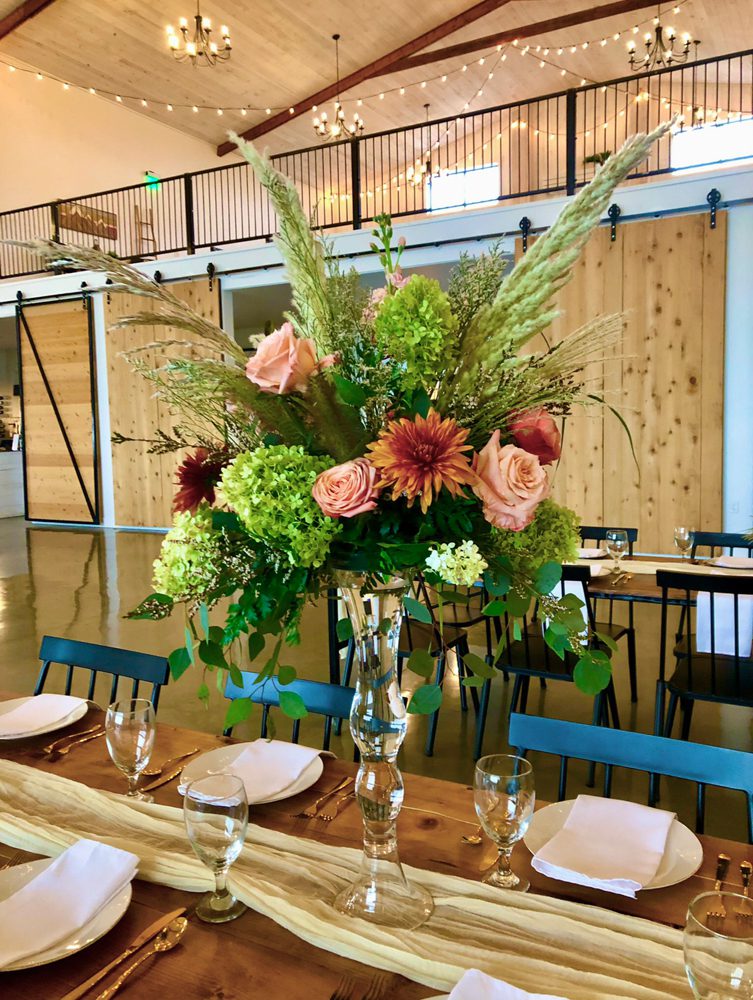 a closeup look of a beautiful bouquet of flowers in a clear base