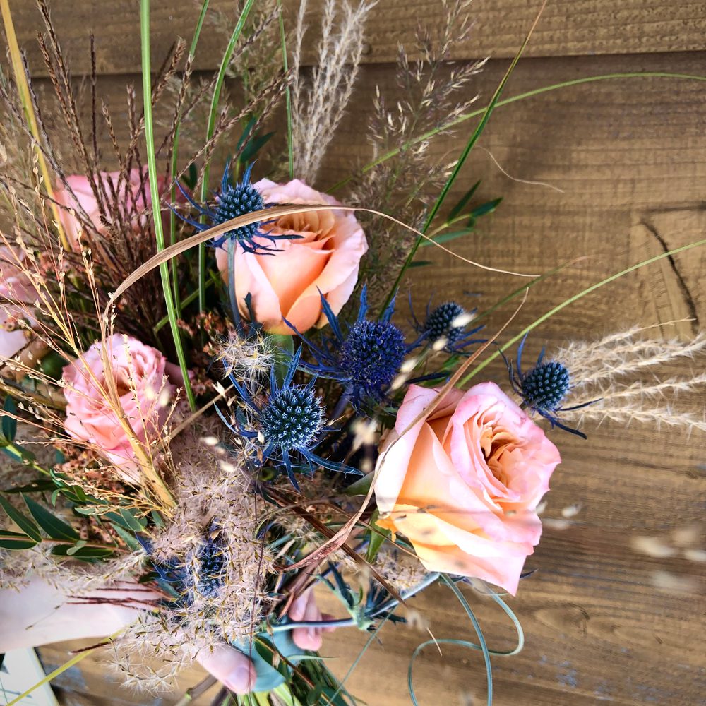 closeup shot of holding a beautiful bouquet of flowers