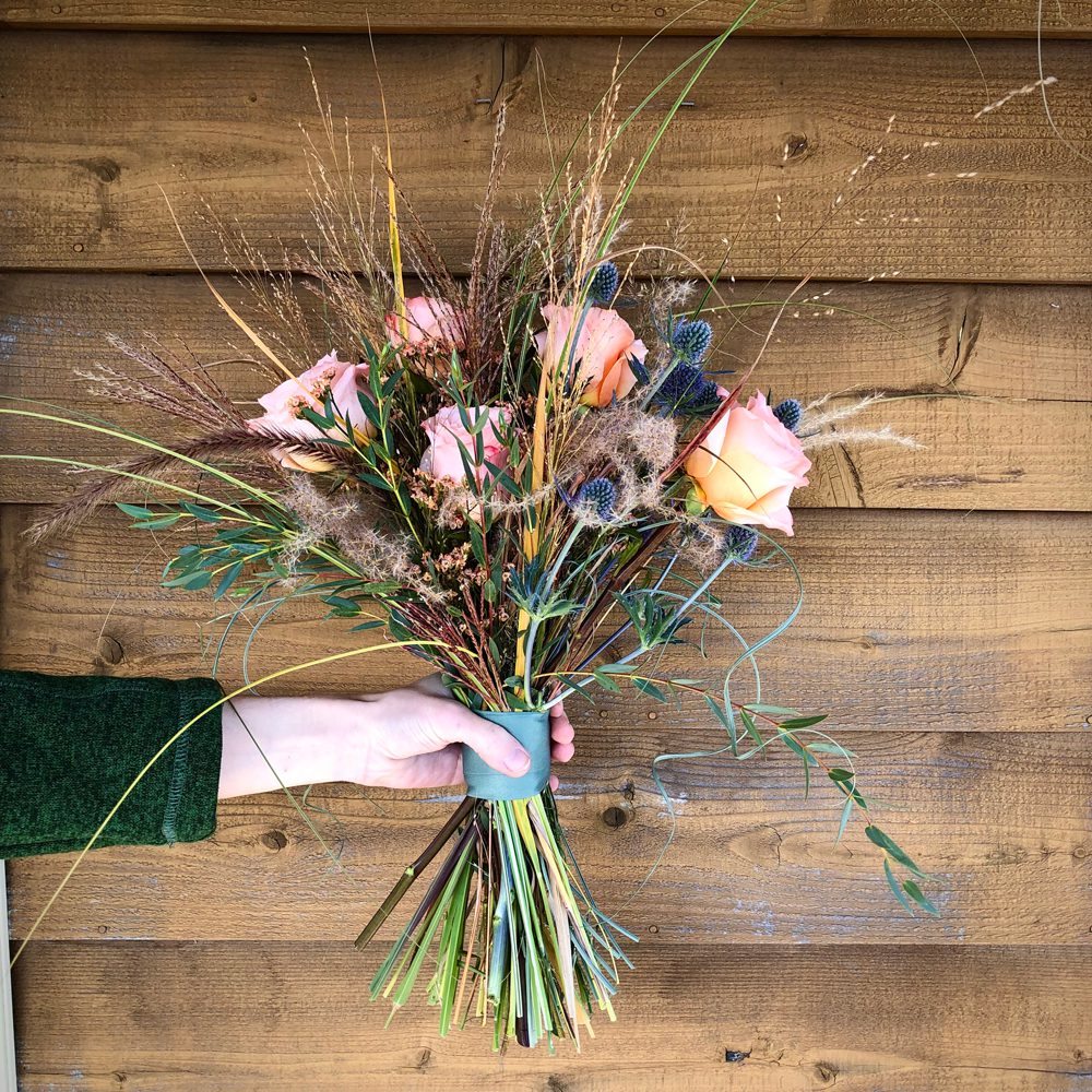 holding a beautiful bouquet of flowers