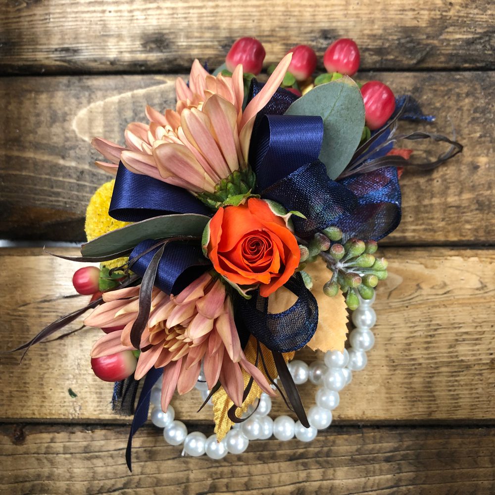 bouquet of flowers with navy ribbon and white pearls