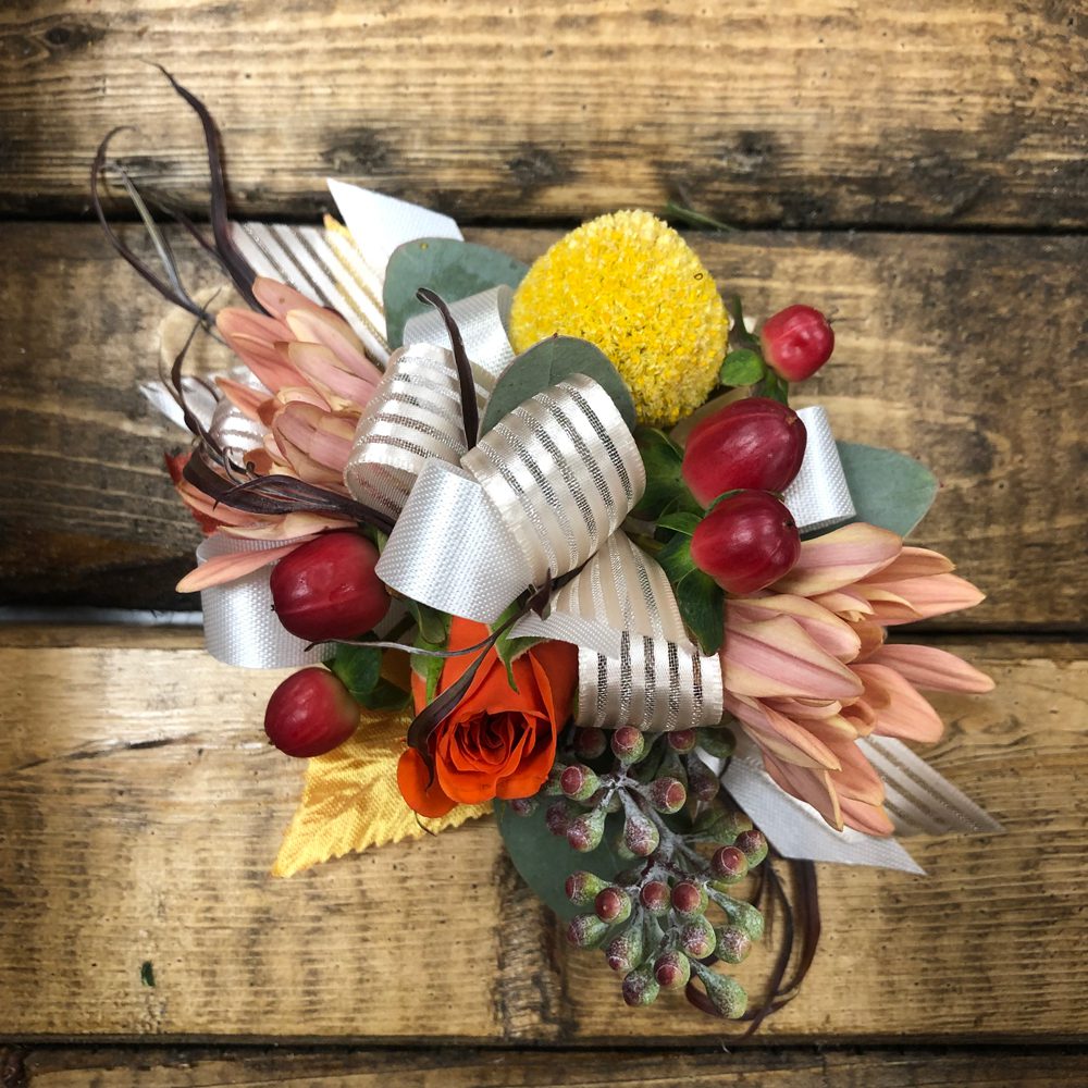 bouquet of flowers with white ribbons