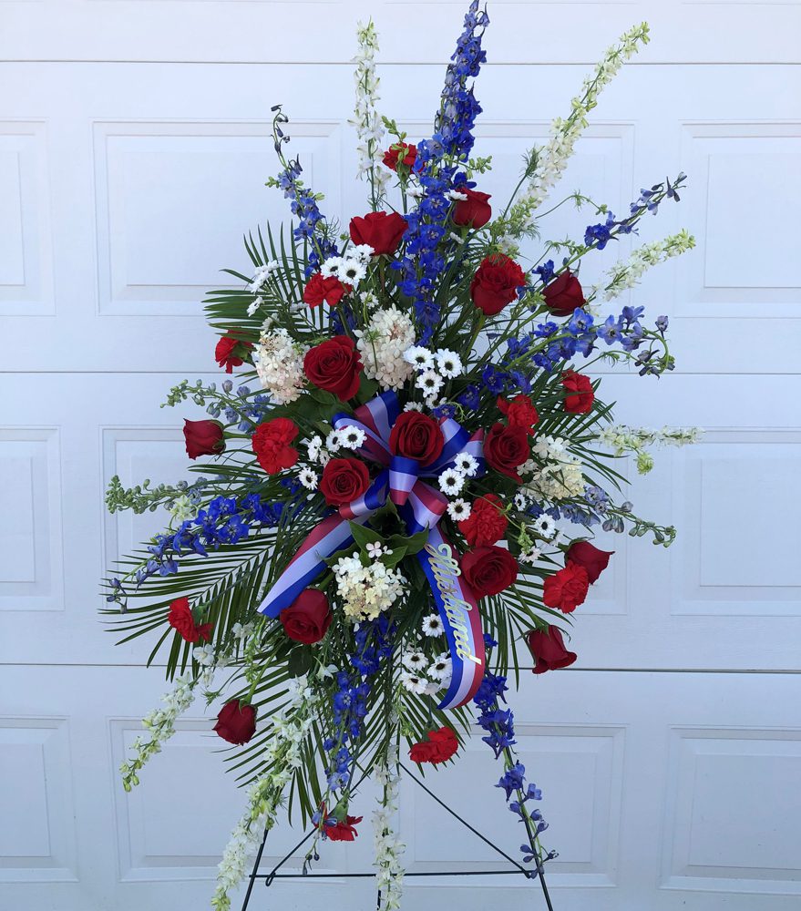 bouquet of flowers on a stand for the memorial of the husband