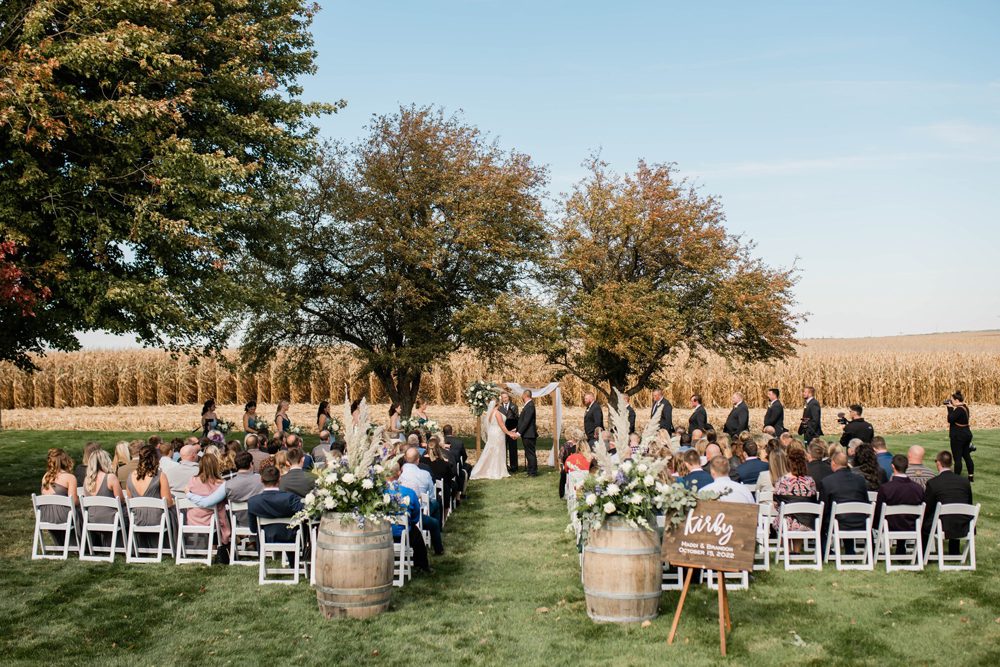 shot of wedding ceremony near a corn field