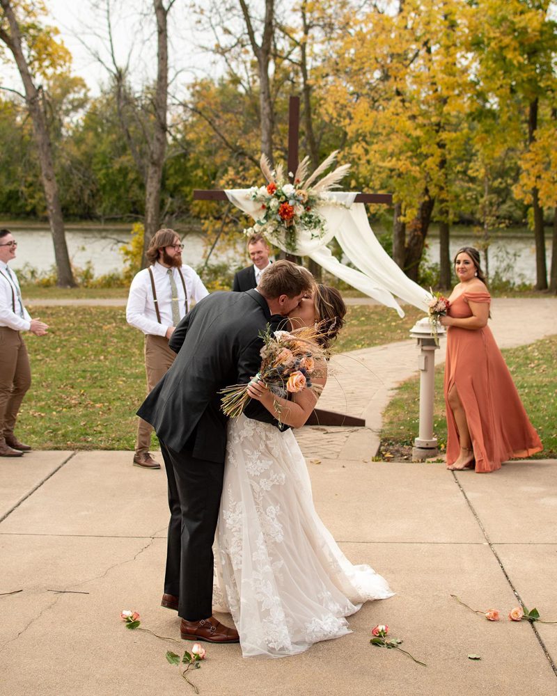 kissing couple after wedding ceremony